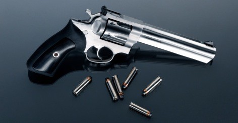.38 special ammo and revolver .38 special ammunition and revolver on a table.